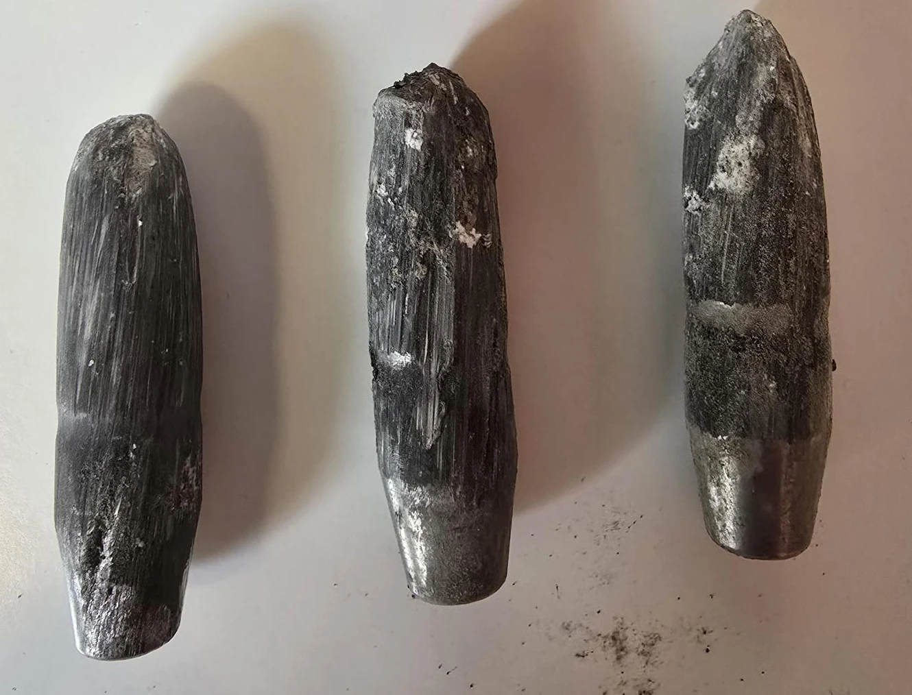 Three .50 BMG projectiles recovered after consecutive impact on the same Delta Panel